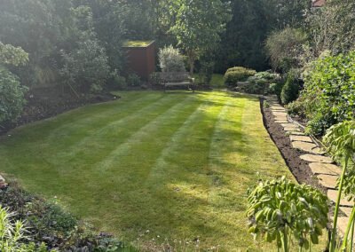 Adam’s Gardening using push mower for lawn care